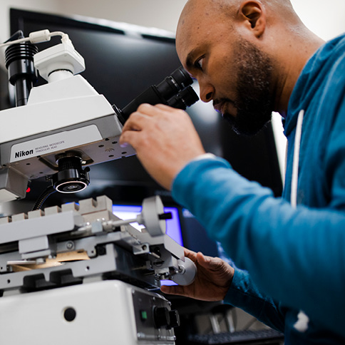 Man using a microscope