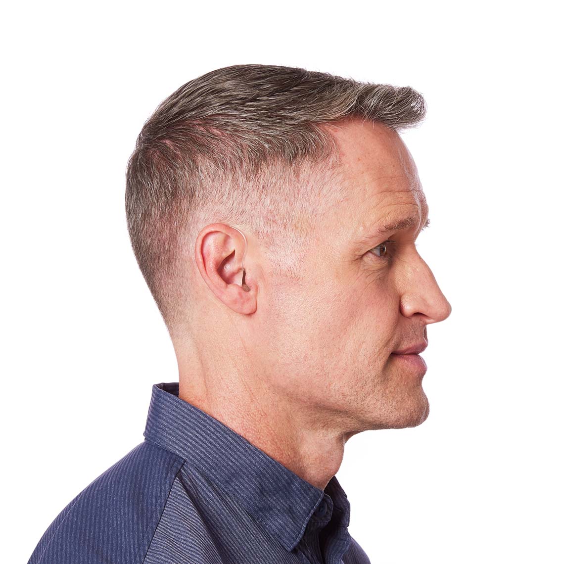 A Sterling micro RIC 312 AP on a man's ear