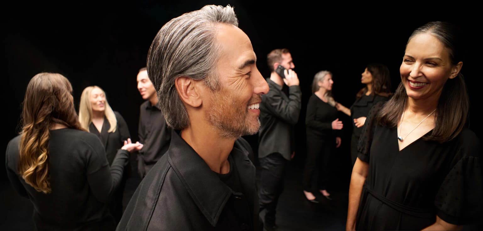 crowd of people in a black room
